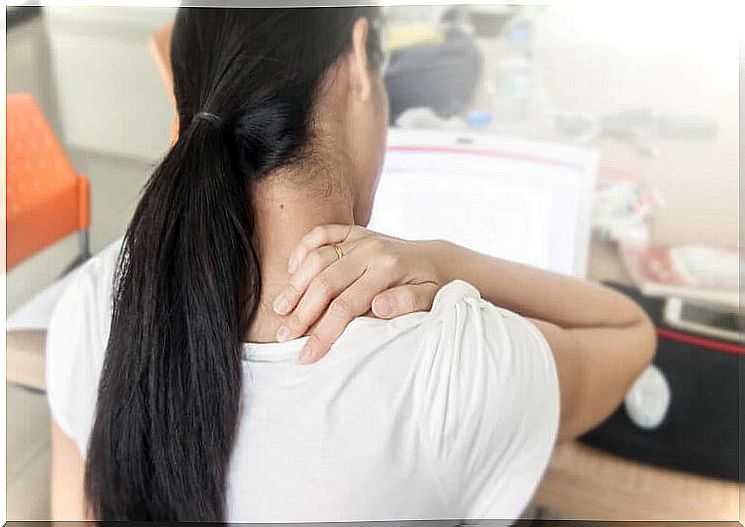 Woman with neck pain at work