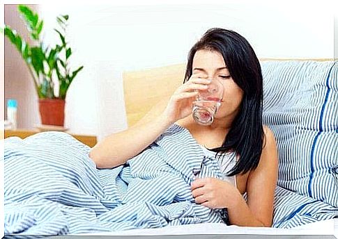 Woman drinks water in the morning