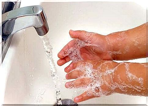 A person who washes his hands with soap