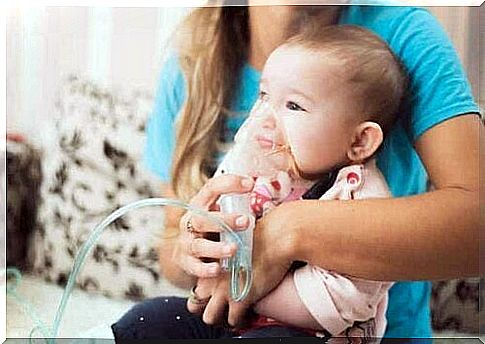 A baby wearing an oxygen mask.