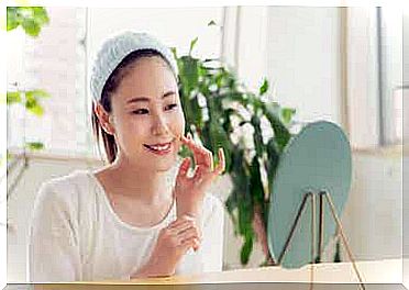 A woman using peptide cream