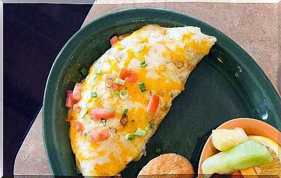 Delicious French omelette with cheese and ham