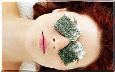 Tea bags cover a woman's eyes