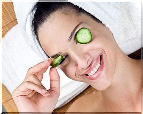 Woman with cucumber over her eyes