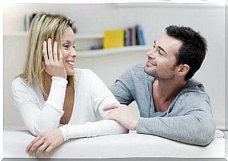 man and woman talking and smiling