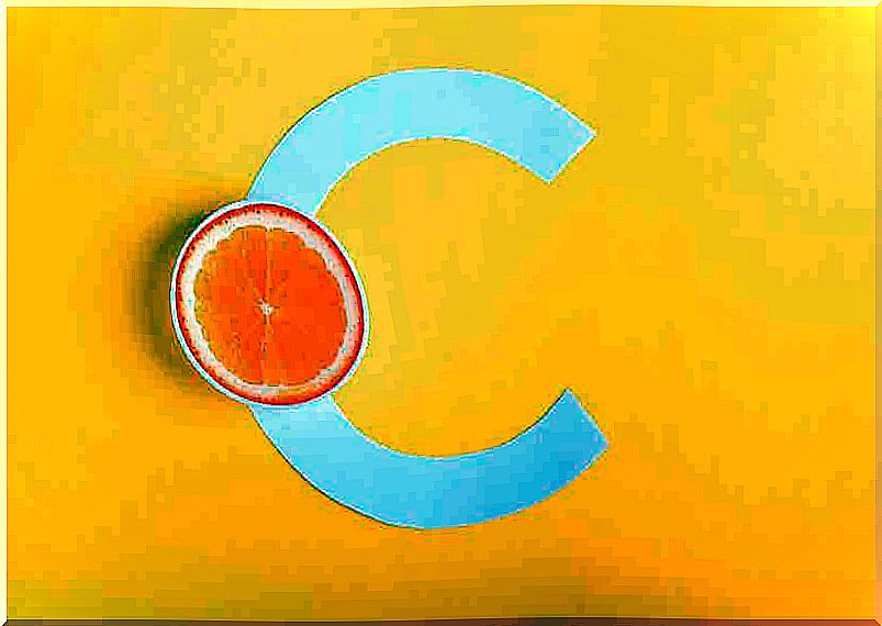 An orange half sits on a capital letter C.