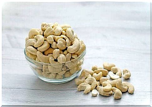 A small glass bowl with cashews