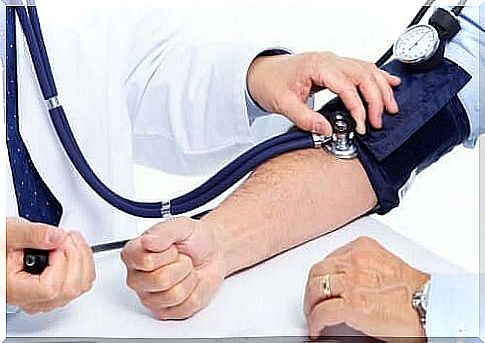 A doctor who takes someone's blood pressure.