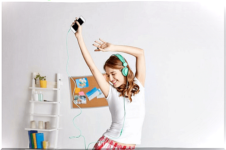 Girl dancing and listening to music