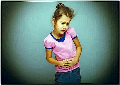 Girl with abdominal pain due to diseases of the digestive system